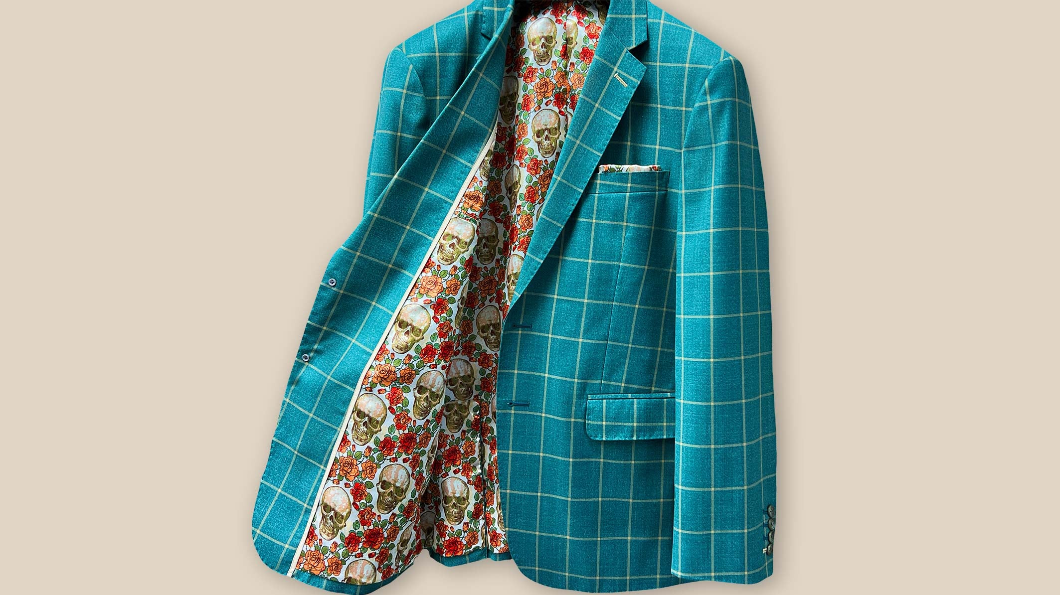 A finely tailored 100% wool green windowpane sportcoat by Westwood Hart, elegantly displayed with complementing shirts, trousers, and accessories for various semi-formal occasions.