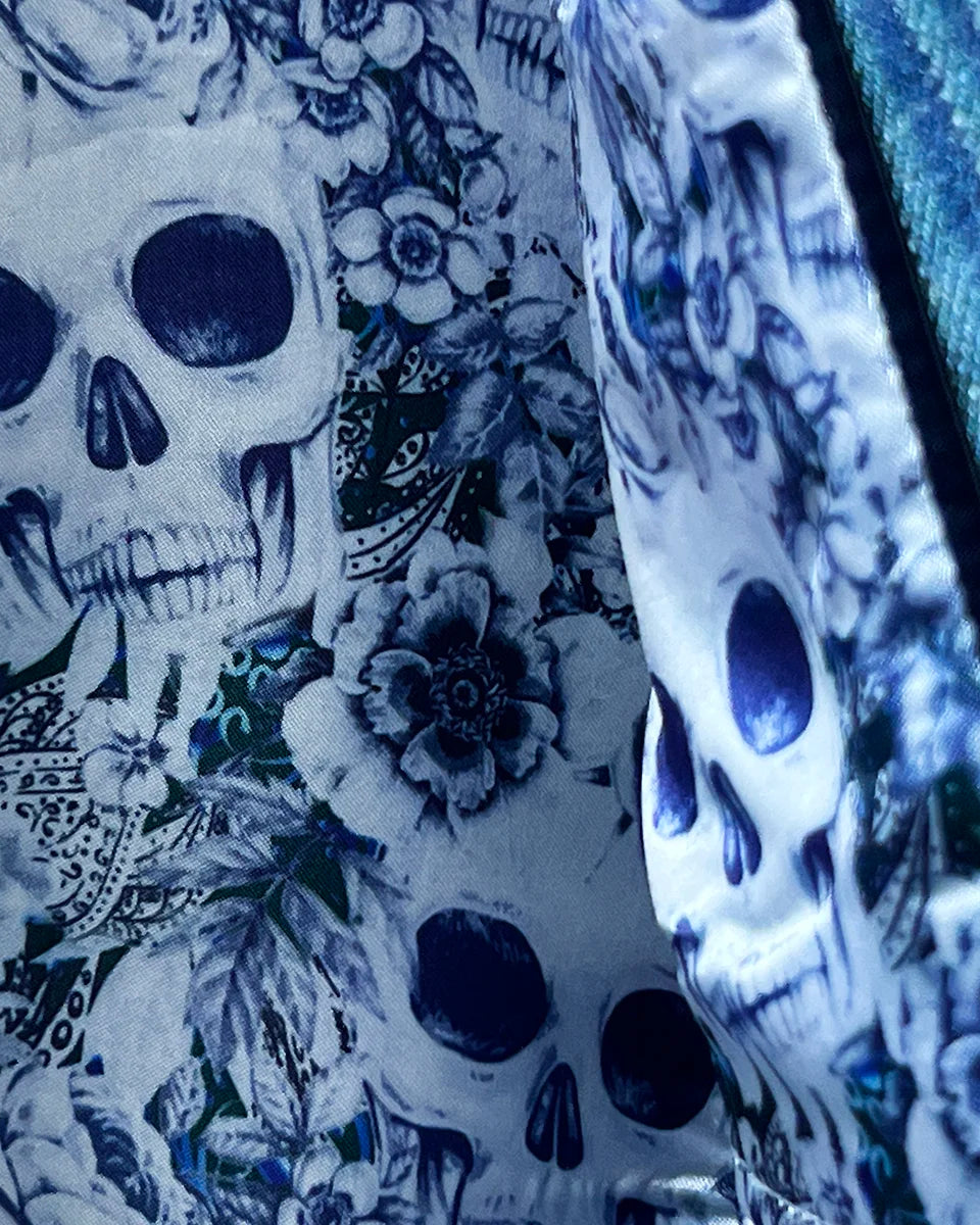 Interior view showing the men's sportcoat's flash linings in blue and white rose and skull design.