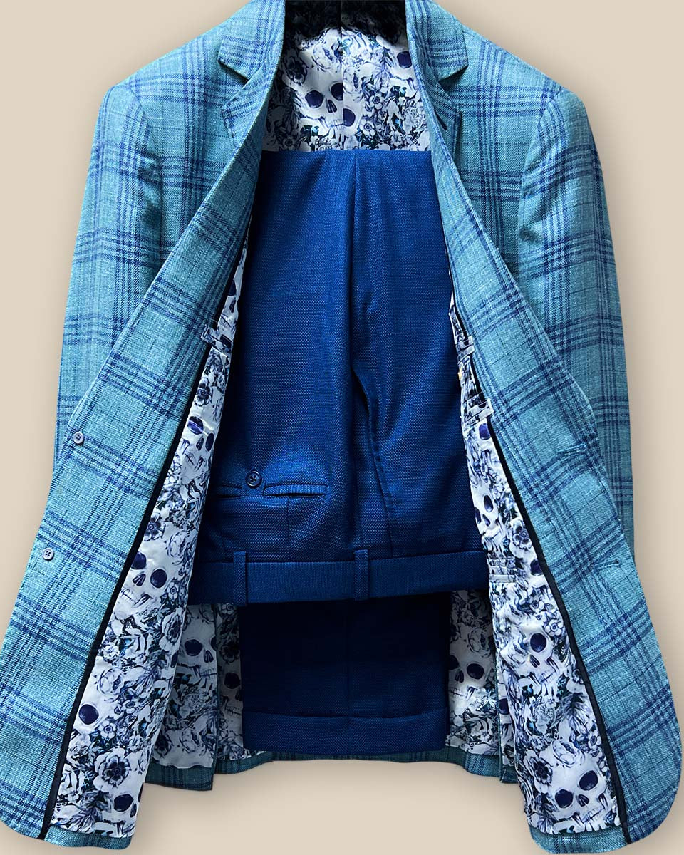 Front view of the green with blue plaid men's sportcoat paired with matching cobalt blue trousers.