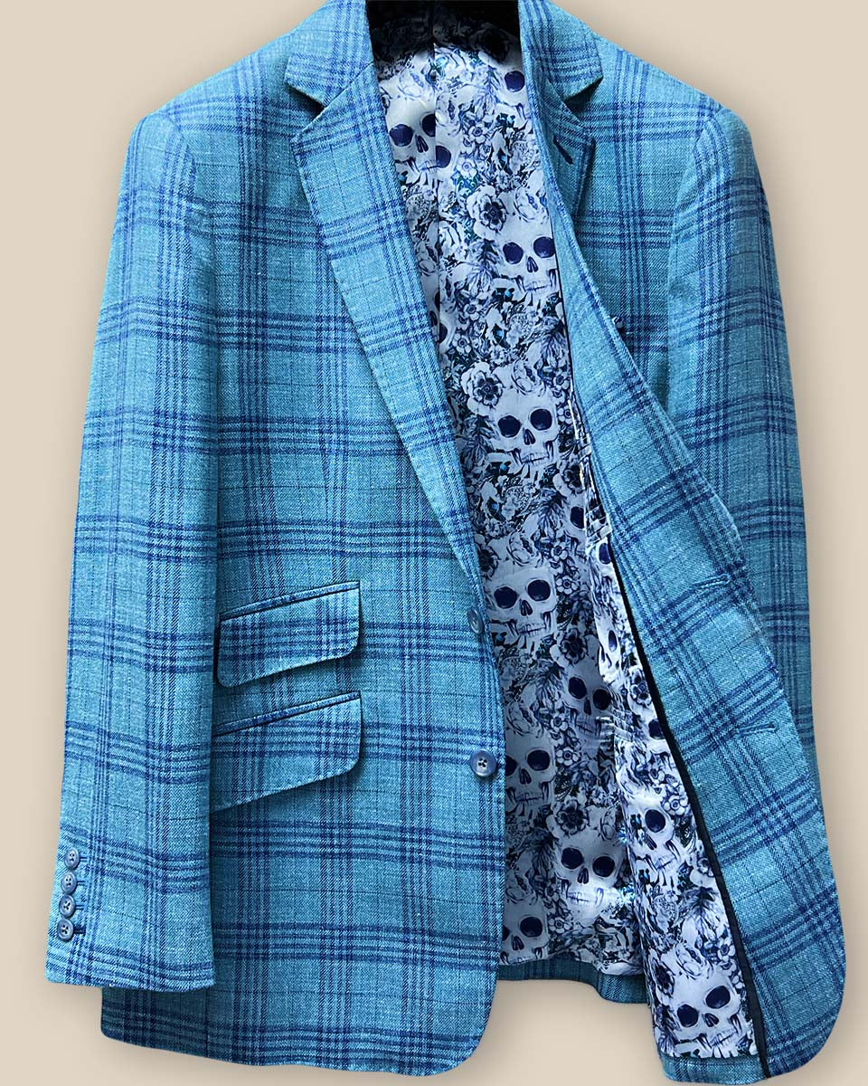 Inside view of the men's sportcoat's left side, showing the blue and white rose and skull fancy lining.