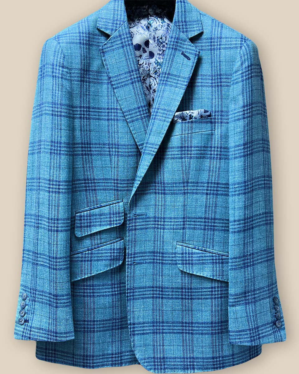 Close-up of the green with blue plaid men's sportcoat's buttonhole panel, featuring dark blue accent stitching.