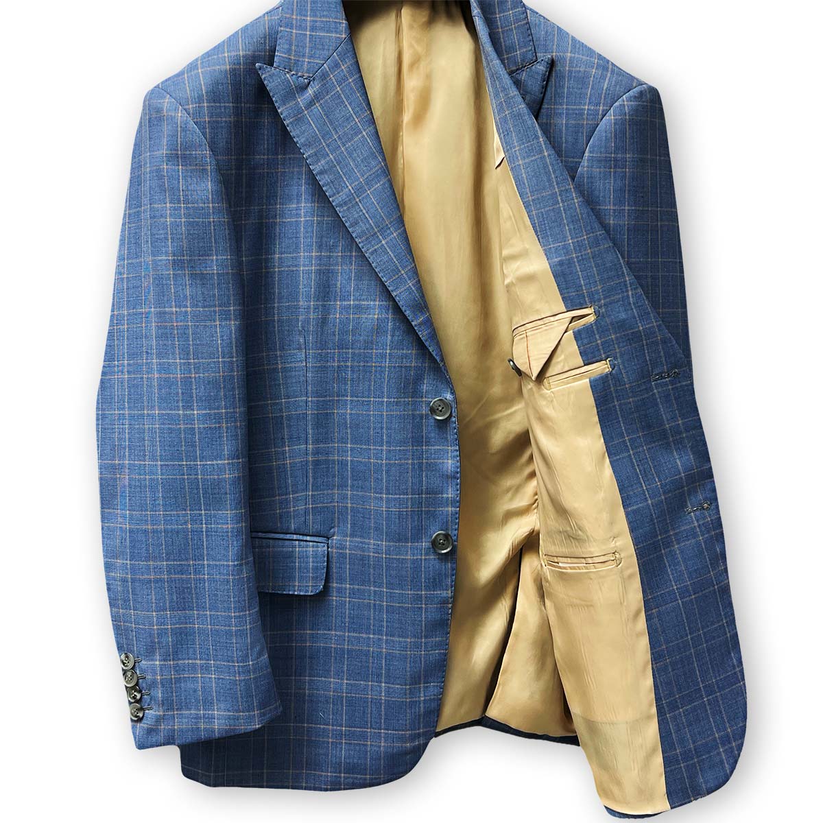 Contrast buttonholes adding flair to a stone blue business suit.