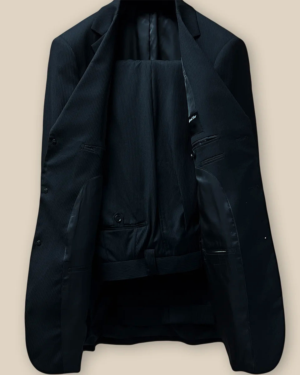 Full view of the two-piece suit, displaying the elegant black herringbone pattern and tailored fit.