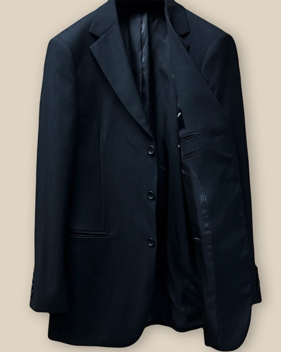 Inside view of the left side of the jacket, featuring the smooth black Bemberg lining and inner pocket.