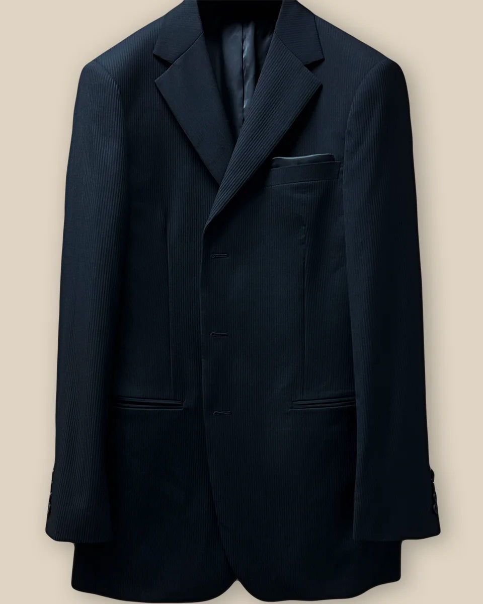 Close-up view of the jacket buttonhole panel, showcasing the black herringbone fabric and meticulous stitching.