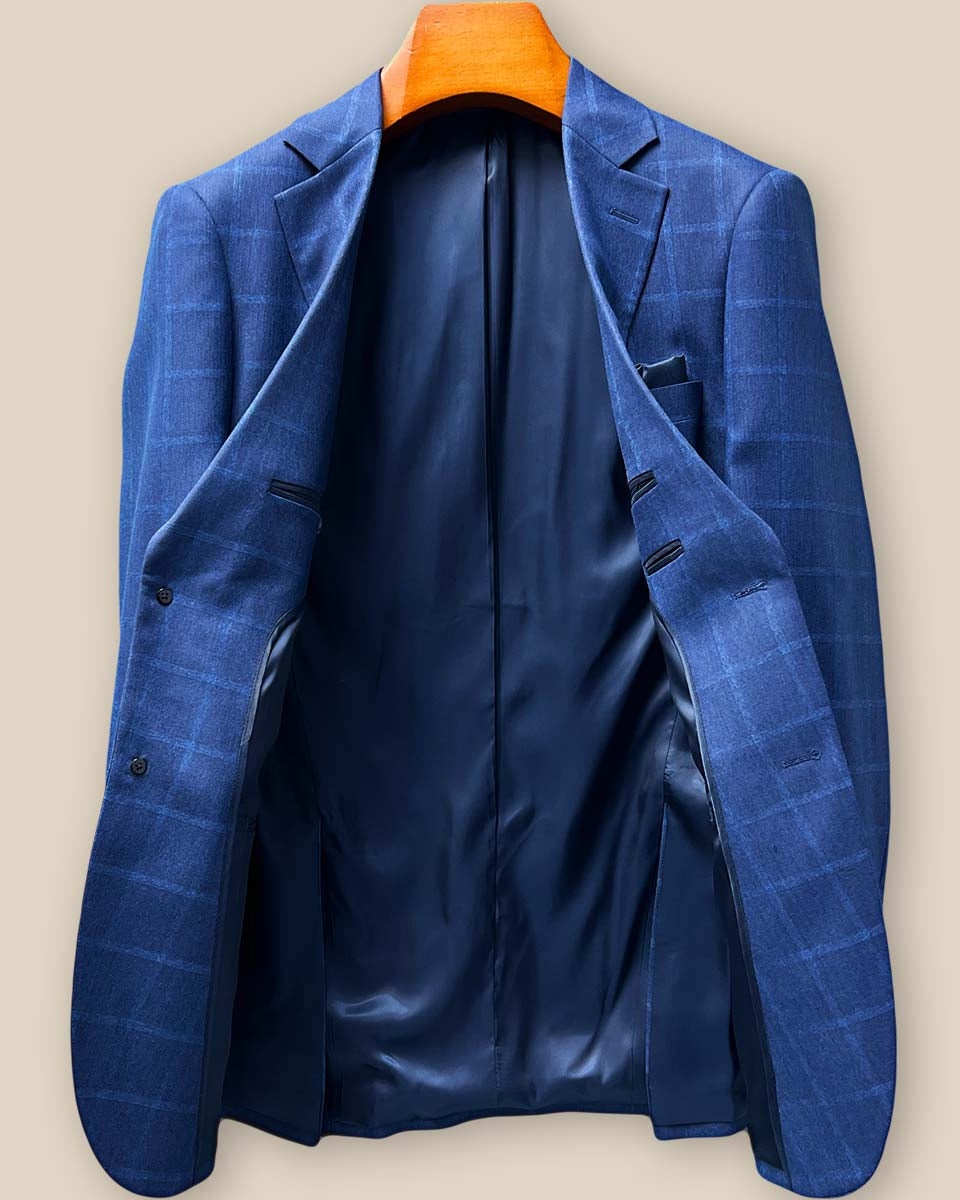 Full view of the luxurious midnight blue bemberg lining in the Indigo Blue Windowpane sport coat, showing smooth texture and rich color