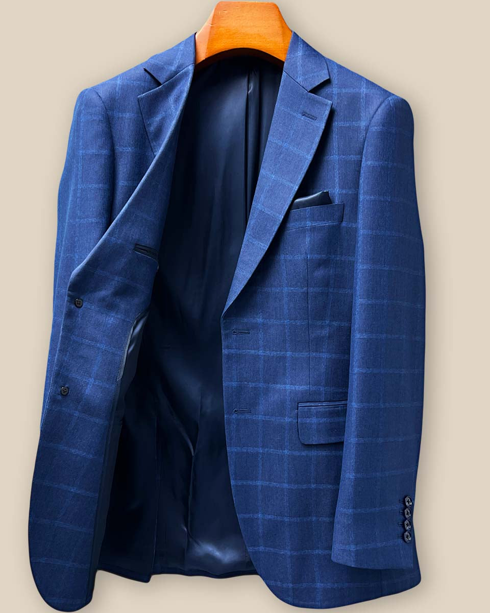 Interior right side construction of the Indigo Blue Windowpane blazer showing internal pockets and fine tailoring details