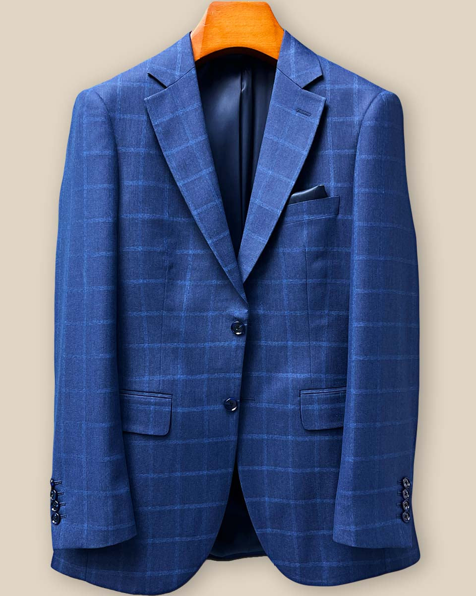 Close-up of the front button panel featuring premium navy horn buttons against the Indigo Blue Windowpane fabric