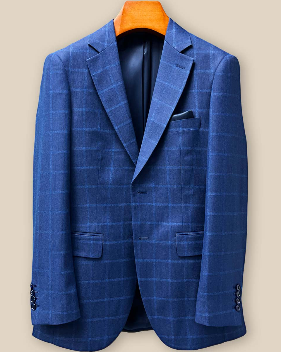 Close-up view of precise buttonhole stitching on the Indigo Blue Windowpane sport coat sleeve, showcasing fine craftsmanship and attention to detail