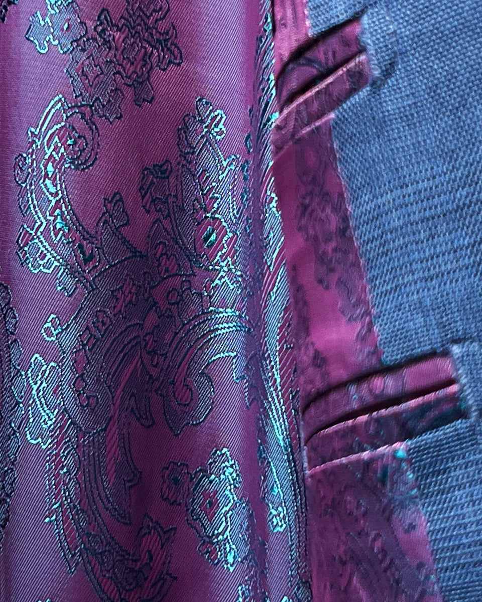 View of the flash linings inside the suit jacket, highlighting the vibrant paisley pattern.