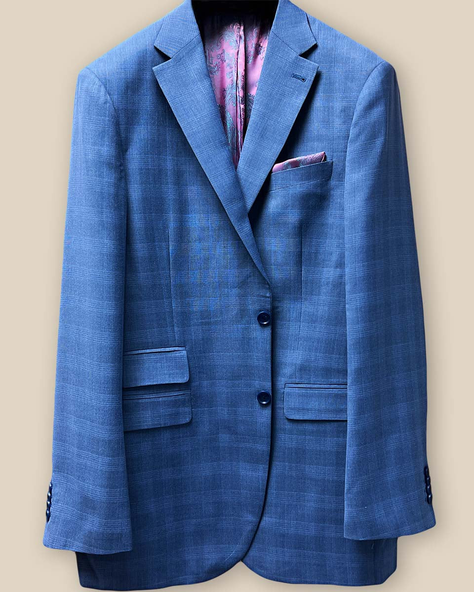 Detailed view of the jacket button panel, featuring medium blue horn buttons.