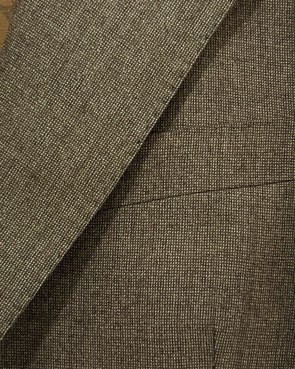 View of the built-in pocket square on the Westwood Hart brown nailhead men's suit jacket, adding a touch of elegance to the design.