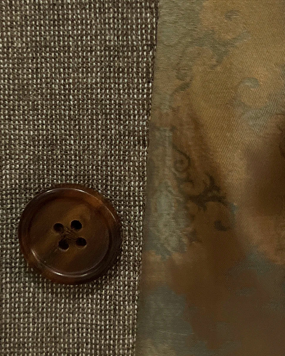 Close-up of the brown horn marble buttons on the Westwood Hart brown nailhead men's suit, highlighting the natural elegance of the buttons.