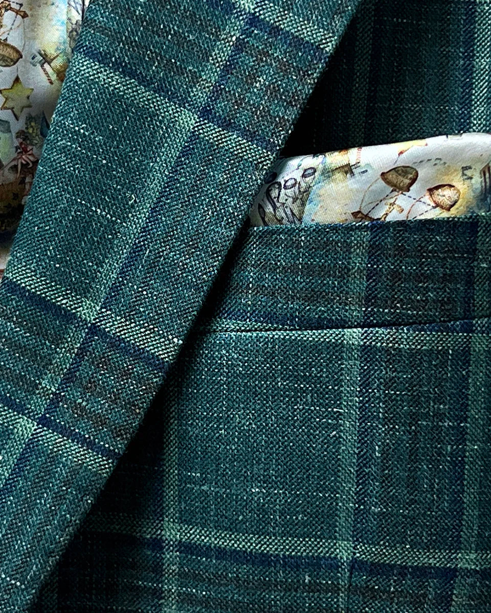 View of the built-in pocket square on the Westwood Hart hunter green with navy and chocolate brown plaid mens sport coat, adding a touch of elegance.