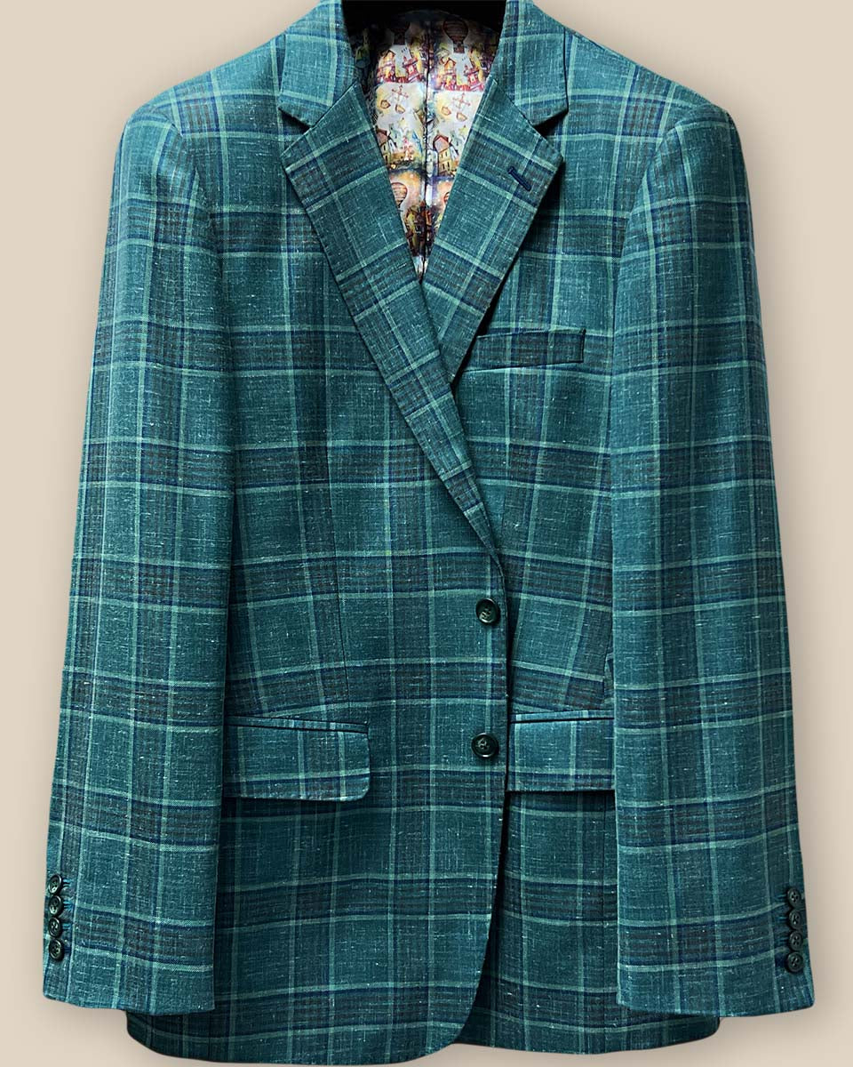 Detailed image of the button panel on the Westwood Hart hunter green with navy and chocolate brown plaid mens sport coat, featuring dark green horn buttons.