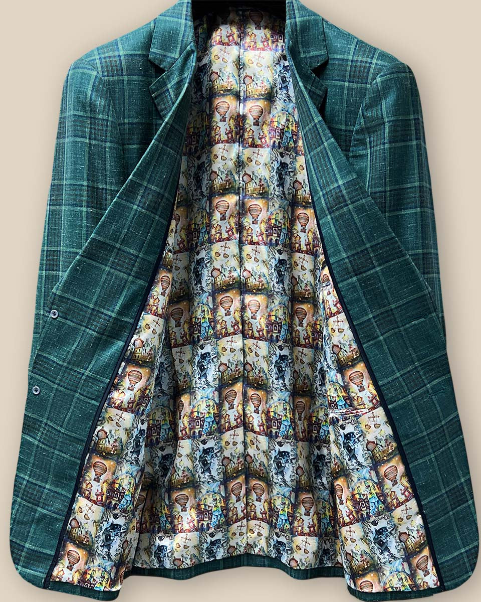 Full view of the whimsical Wizard of Oz flash lining inside the Westwood Hart hunter green with navy and chocolate brown plaid mens sport coat.