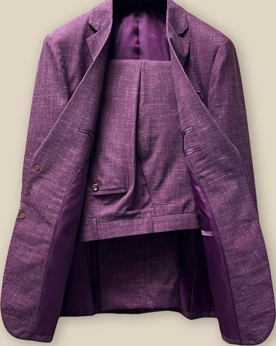 Front and back views of a two-piece cranberry men's suit by Westwood Hart, demonstrating its elegant and lightweight design.