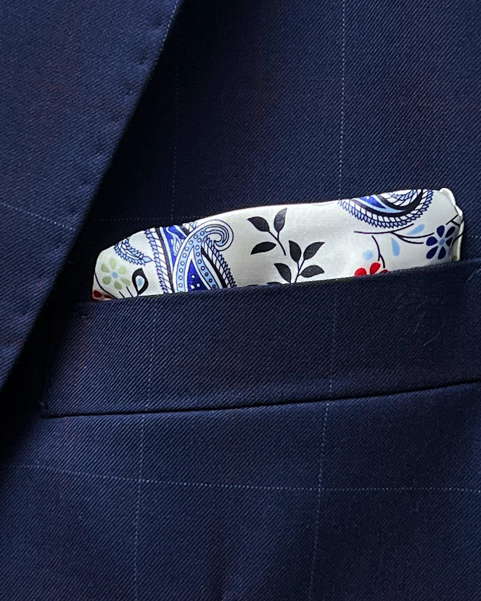 Close-up of built-in pocket square showing the white accent fabric that coordinates with the buttonhole detailing