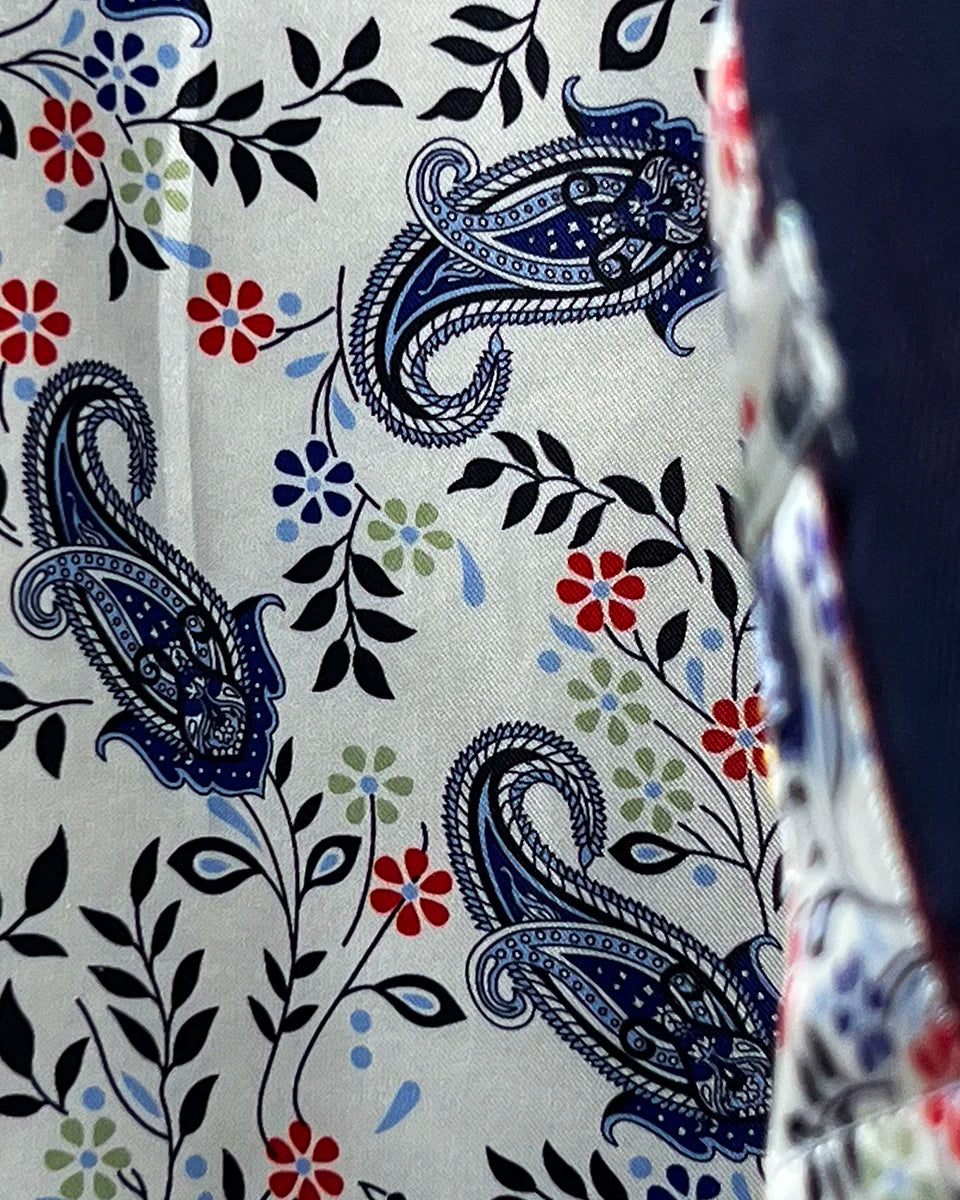 Close-up of the distinctive white with navy and red paisley lining that adds personality to the business suit