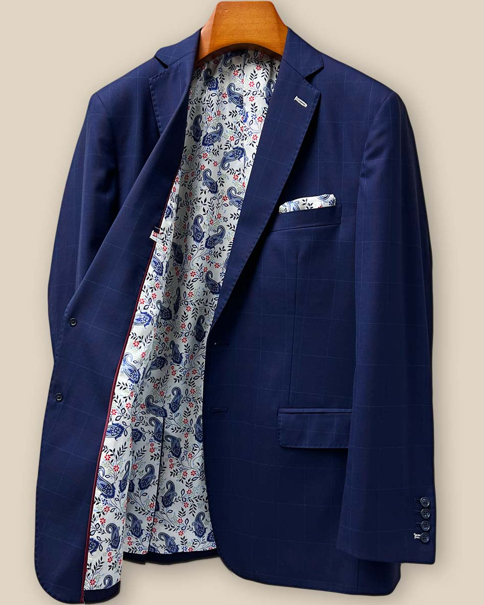 Interior right side view of the navy suit jacket, displaying tailoring details, stitching quality, and lining attachment