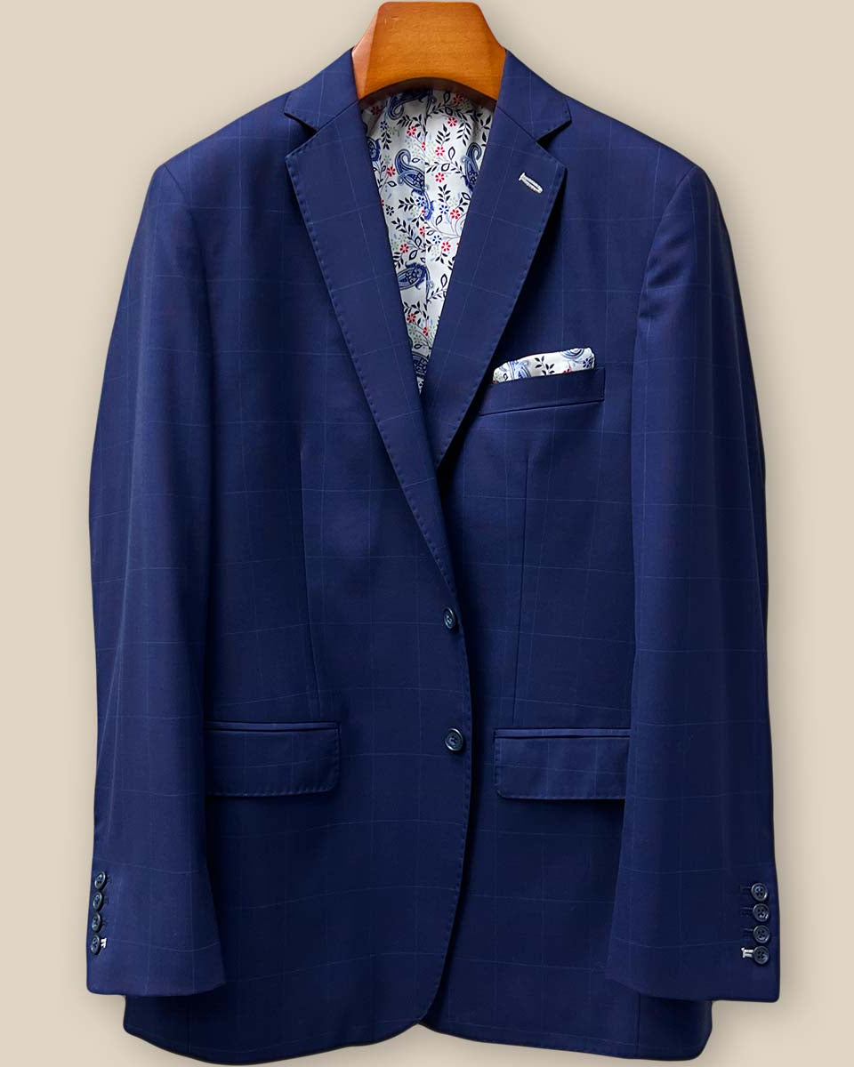 Close-up of the jacket front showing navy horn buttons against the navy and red windowpane Super 130's Australian merino wool