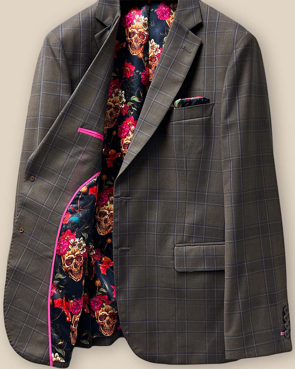 Interior view of the right side of a chocolate brown sportcoat, featuring inner pocket trimming in fuchsia pink.