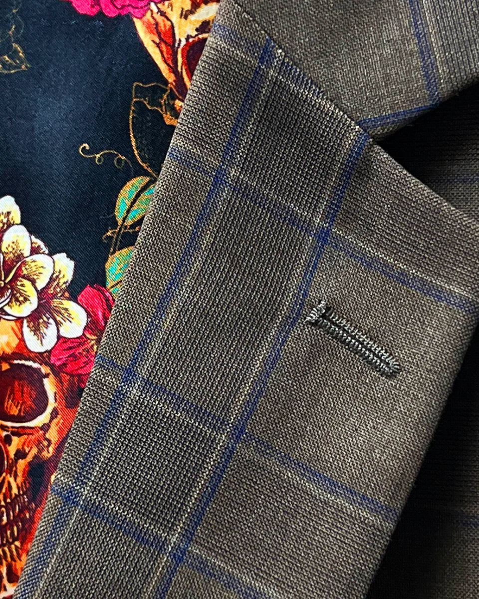 Detailed view of the notch lapel on a chocolate brown sportcoat.