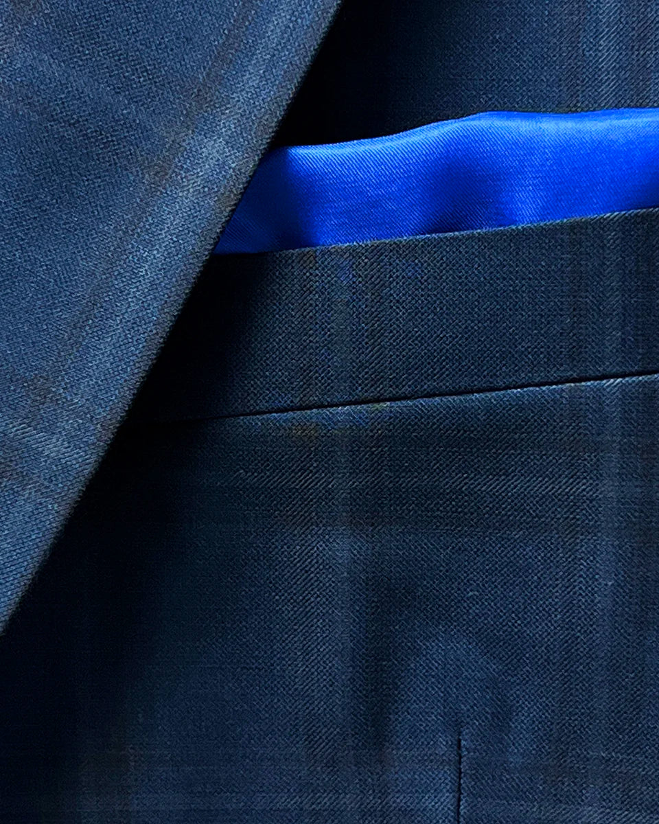 Close-up of the built-in pocket square on the dark midnight blue sportcoat.
