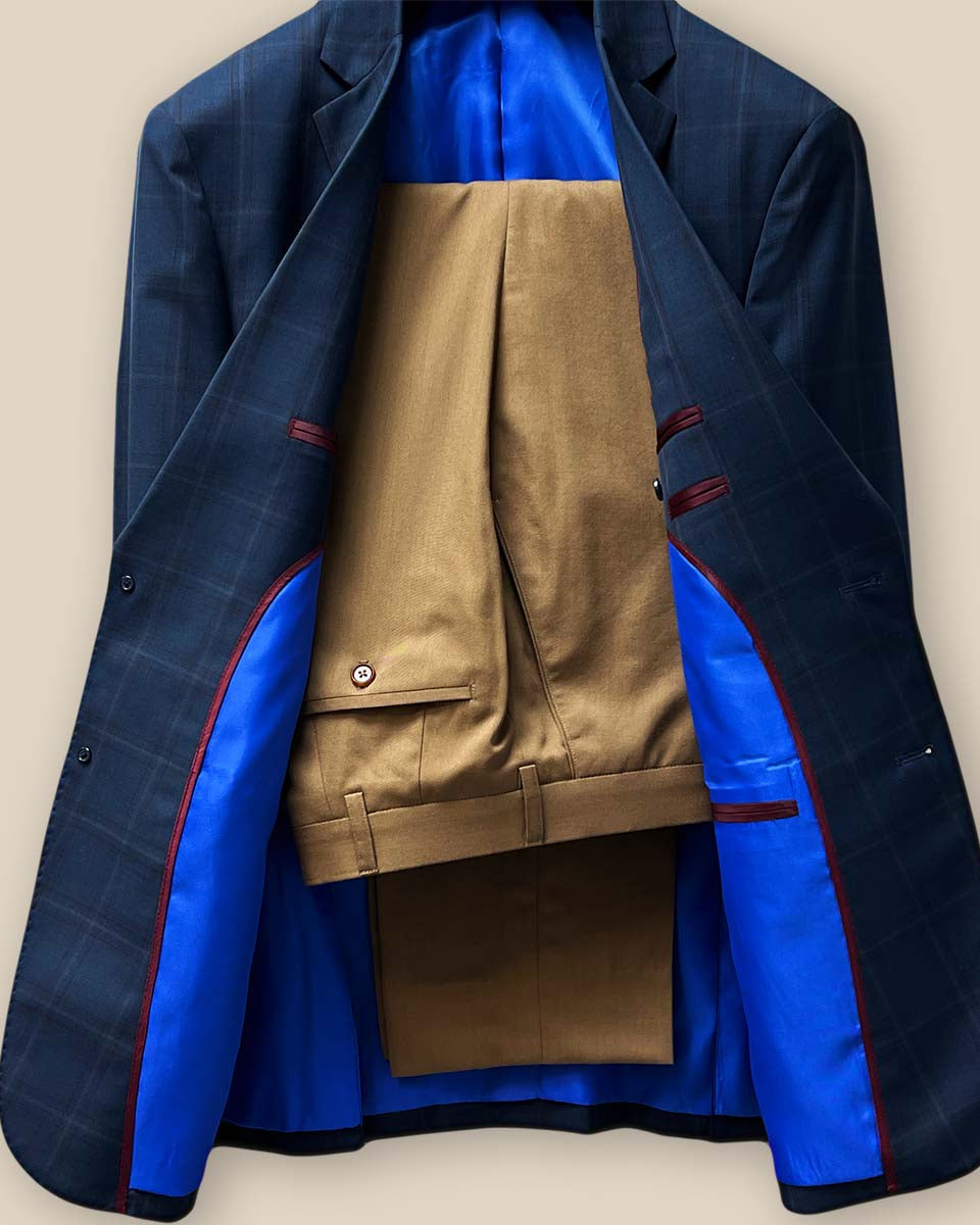 Front view of the two-piece set featuring the dark midnight blue sportcoat paired with tan trousers.