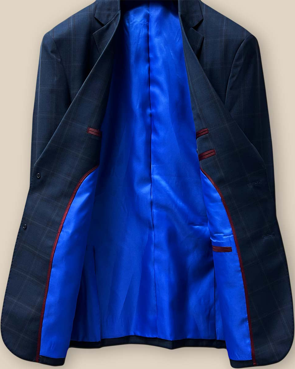 Full view of the sportcoat's interior highlighting the royal blue lining and maroon piping details.