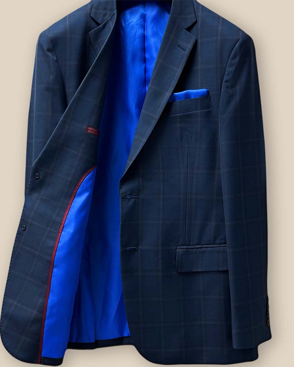 Inside view of the sportcoat's right side showing the royal blue lining and maroon inner pocket details.