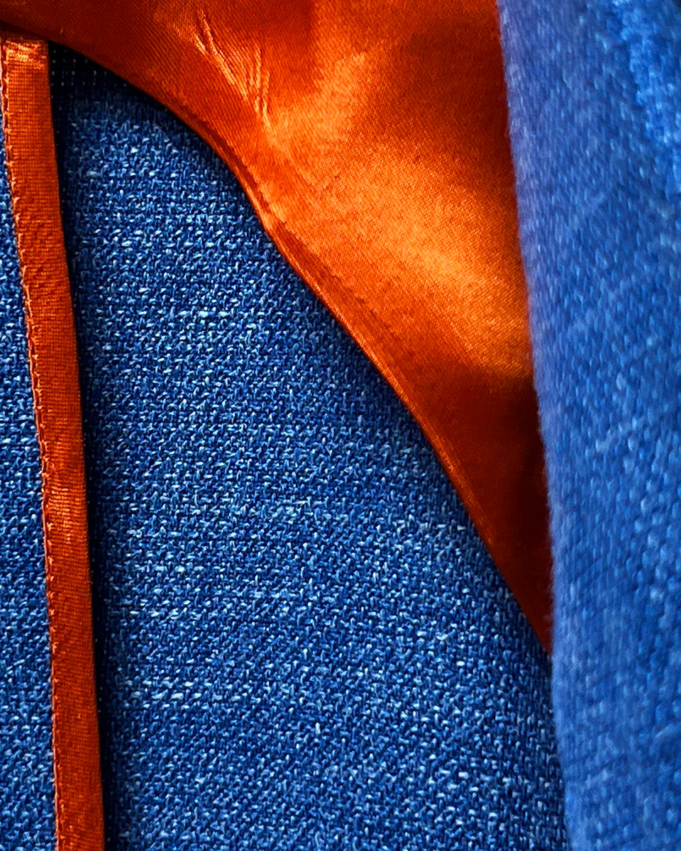 Bemberg lining of the sportcoat, showcasing the high-quality, breathable material and the vibrant orange color.