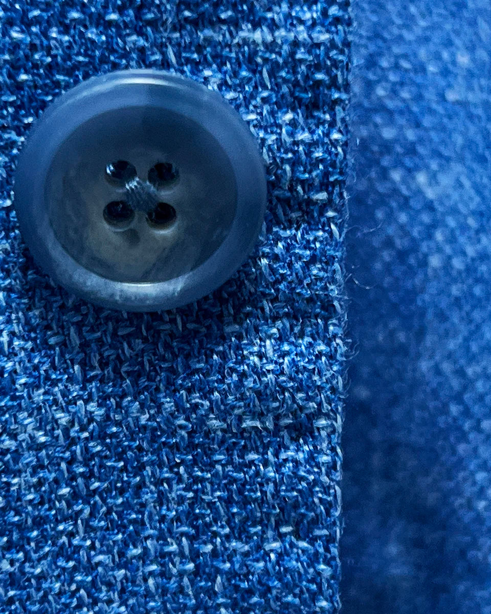 Blue horn marble buttons on the sportcoat, presenting the fine details and exquisite materials used.