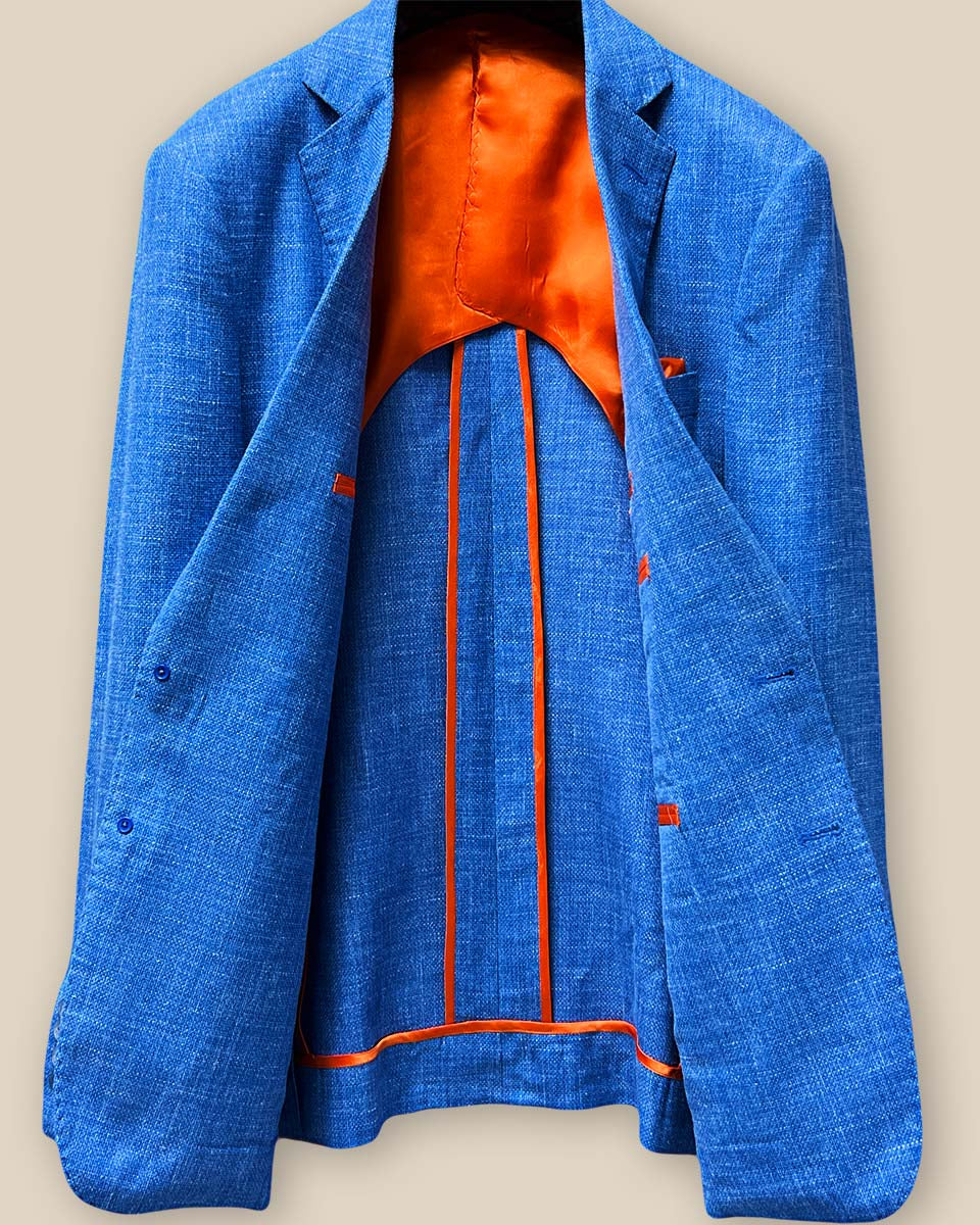 Full inside jacket lining view of the sportcoat, highlighting the striking bemberg orange lining and half-lined design.