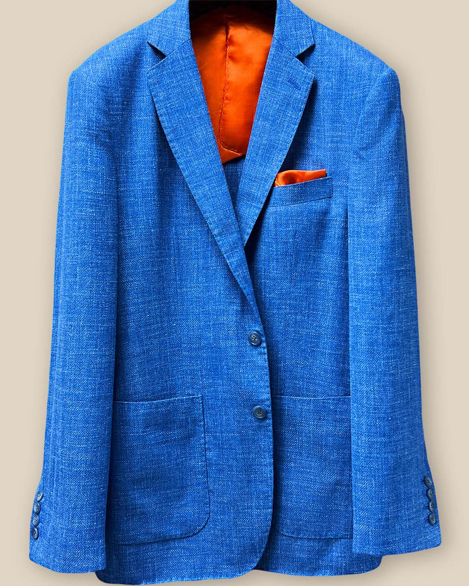 Detailed look at the sportcoat's button panel with blue horn buttons, highlighting the meticulous attention to detail.