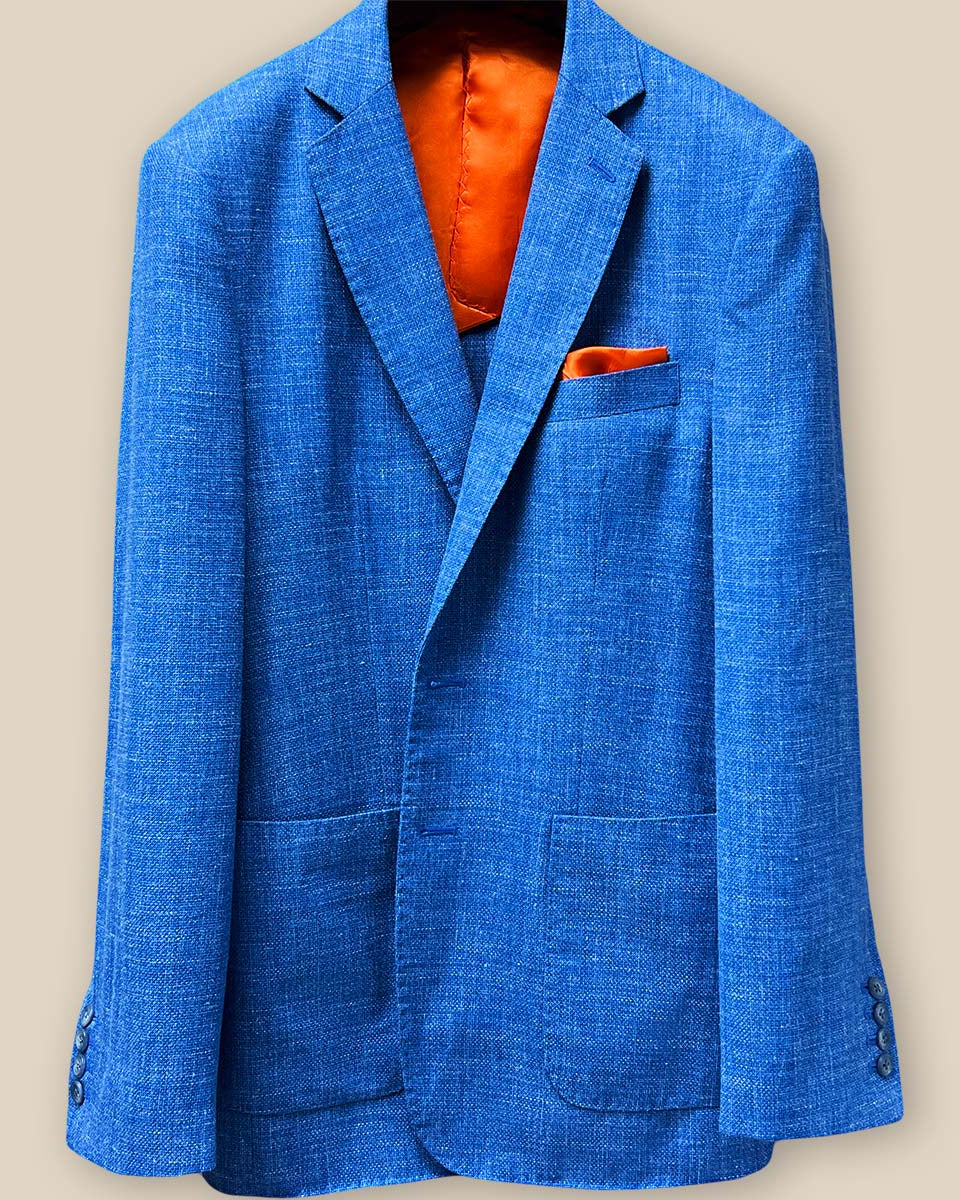 Close-up view of the sky blue sportcoat's jacket buttonhole panel, showcasing the precision of the matching pick stitching and the smooth fabric texture.