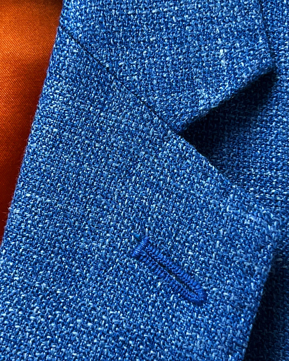 Close-up view of the notch lapel on the sportcoat, showcasing the sharp tailoring and classic design.