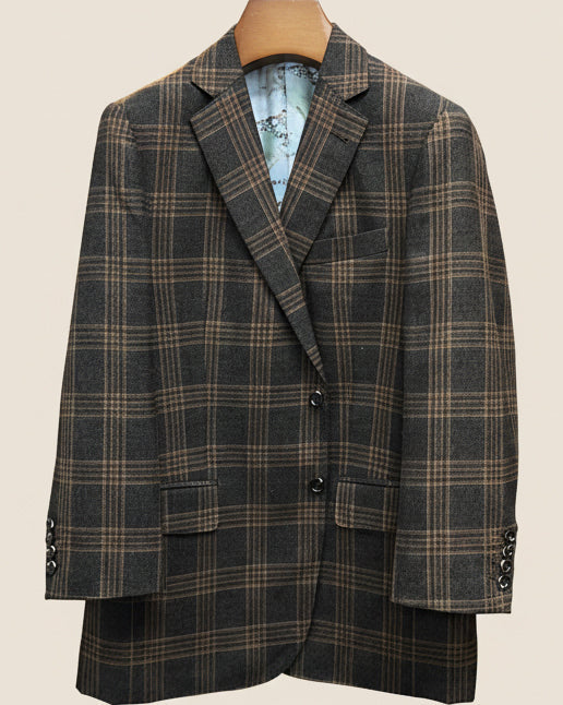 Front button panel of brown rust block windowpane sport coat featuring walnut dark brown and amber horn buttons