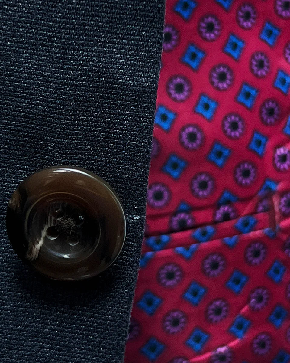 Horn marble buttons on a charcoal grey suit