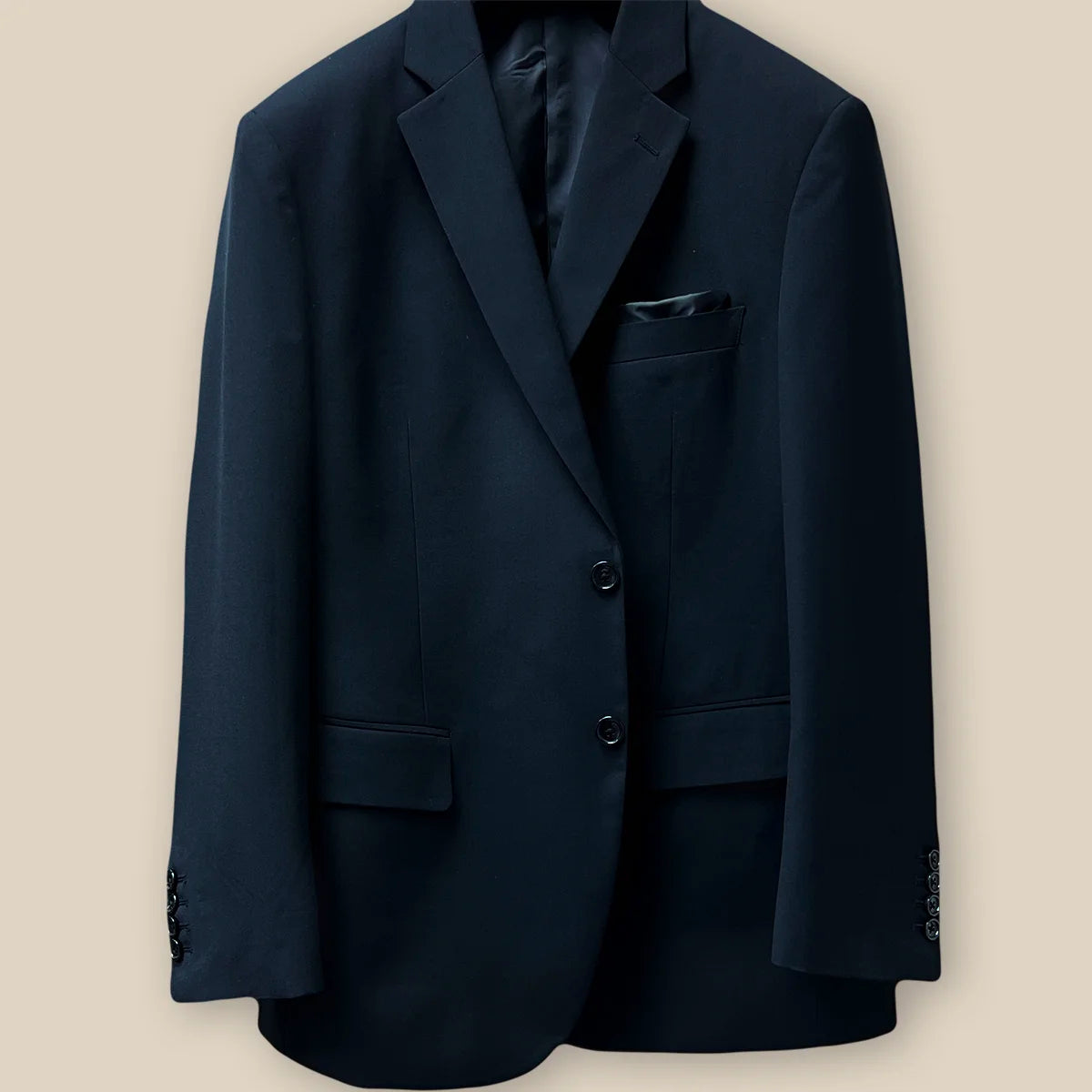 View of the button panel displaying the functional and aesthetic design on a classic black men's suit.