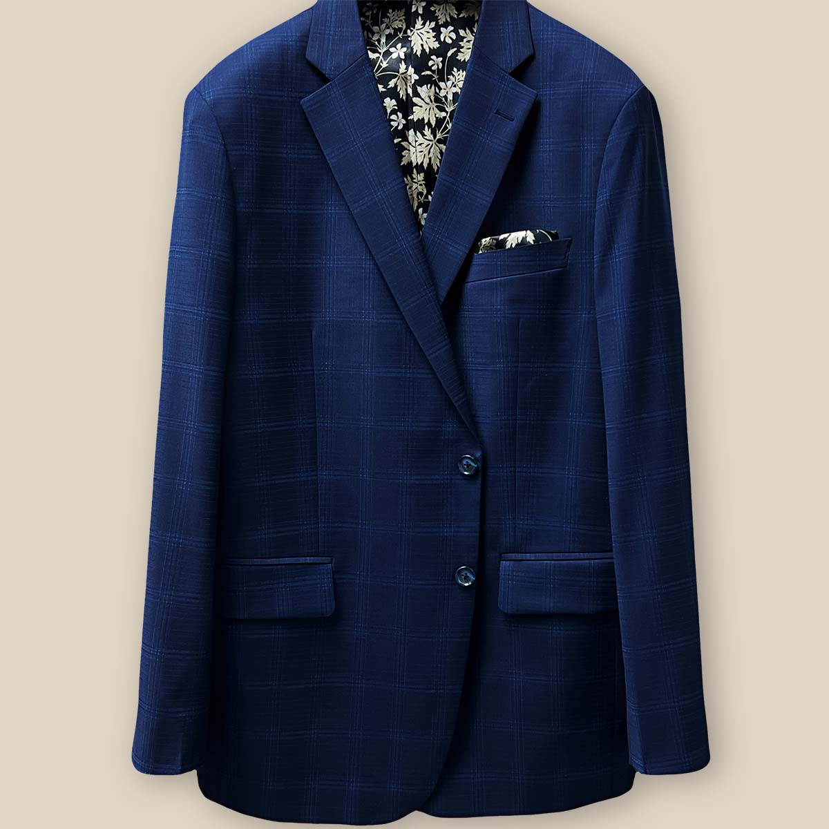 Button panel view showcasing the elegance and functionality on a midnight blue windowpane suit.