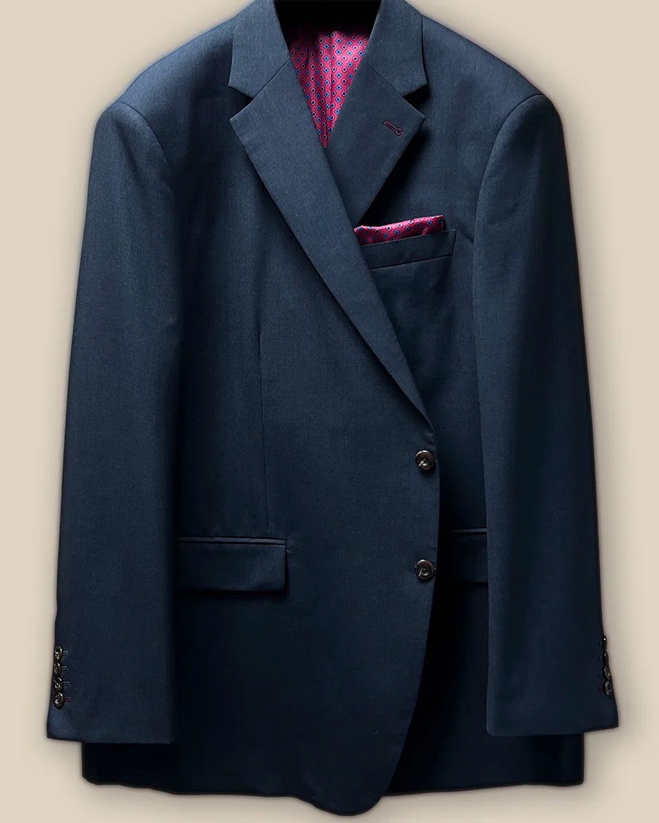 Front button panel of a charcoal grey suit