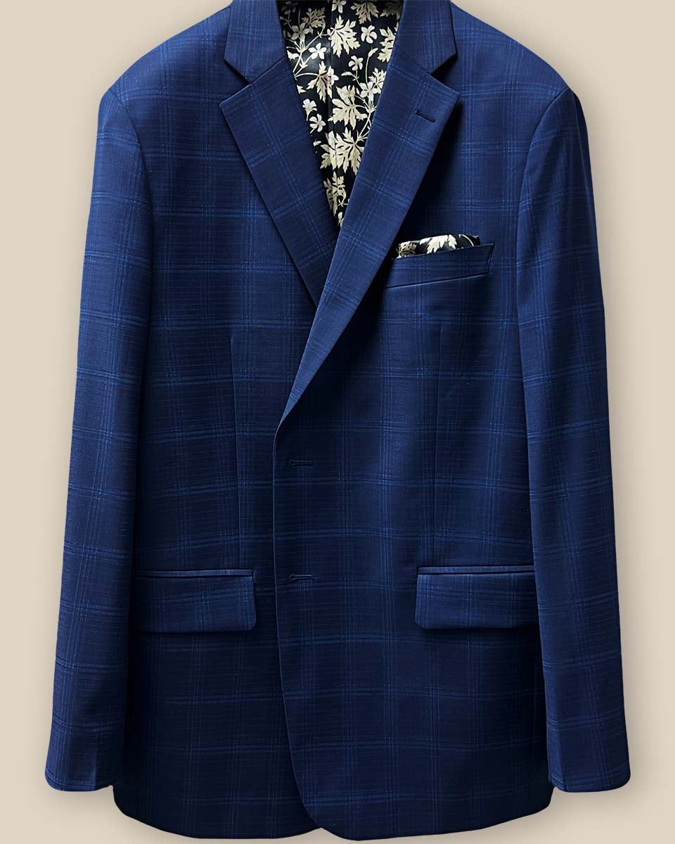 Buttonhole panel view displaying the precision tailoring on a midnight blue windowpane suit.