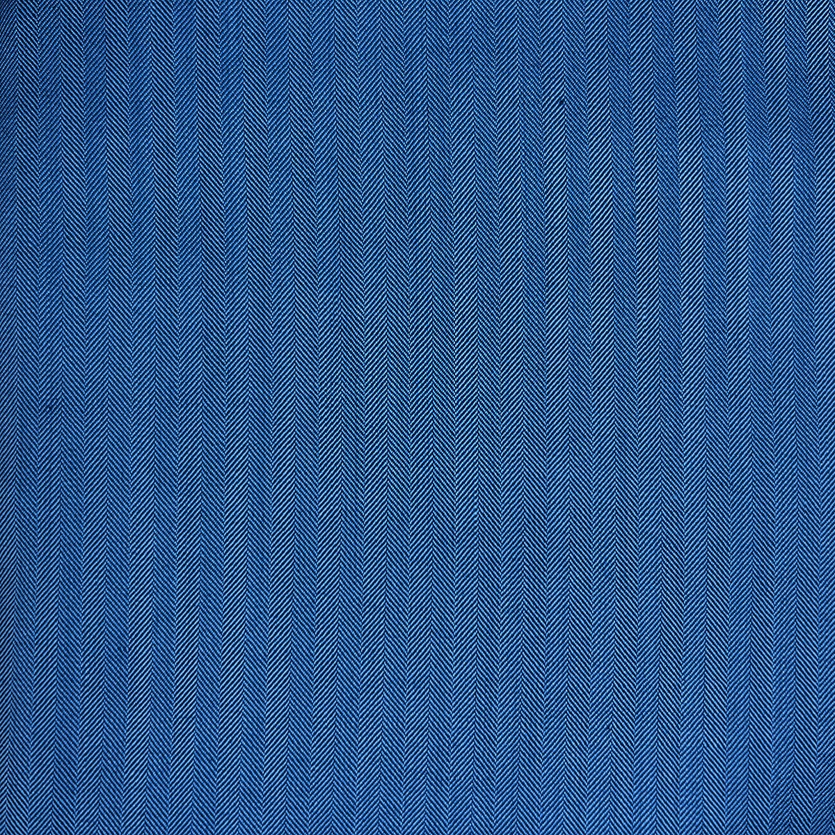 A men's suit in blue herringbone pattern made from 100% Australian Merino wool, crafted for a tailored fit.