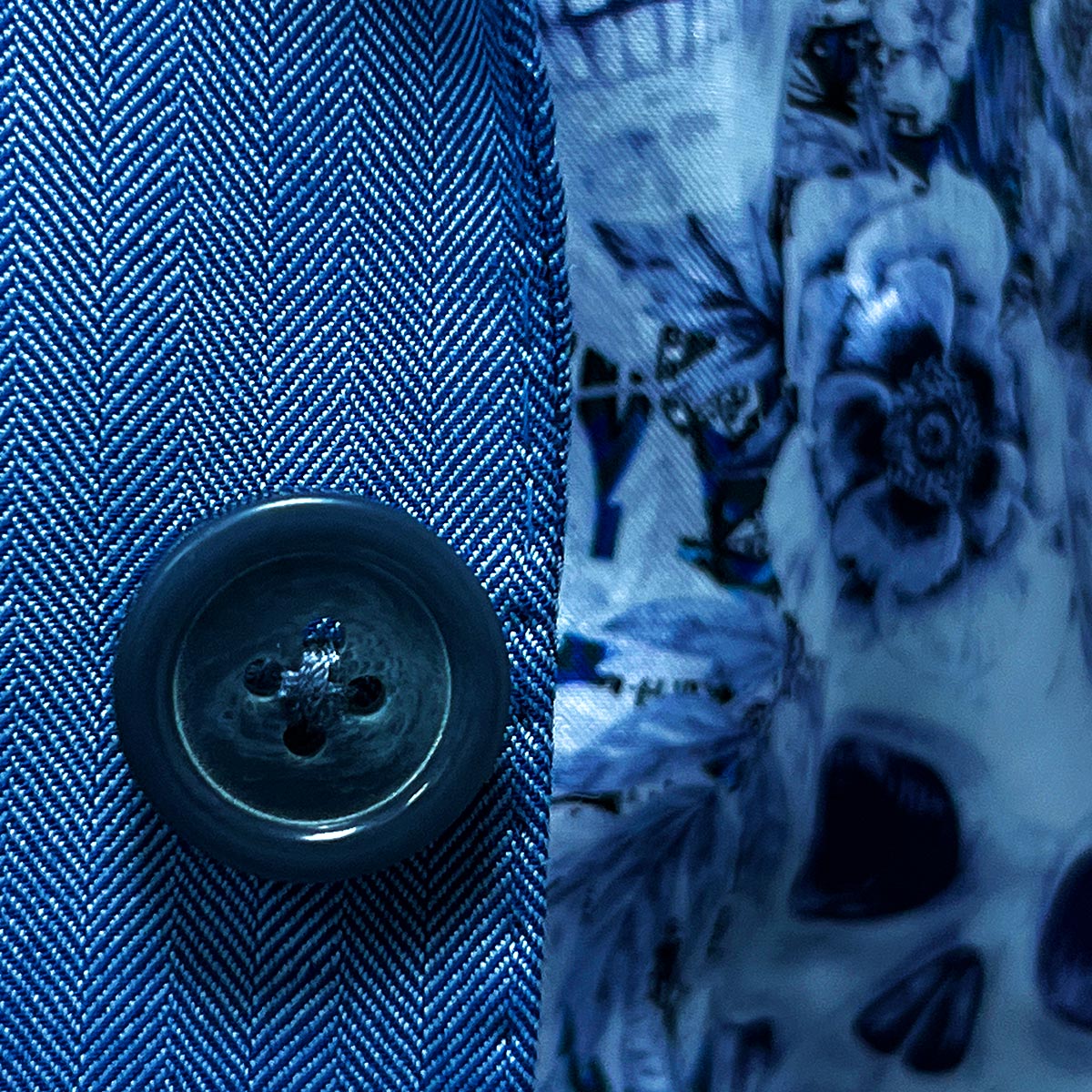 Blue herringbone men's suit, crafted from 100% Australian Merino wool, available at Men's Wearhouse.