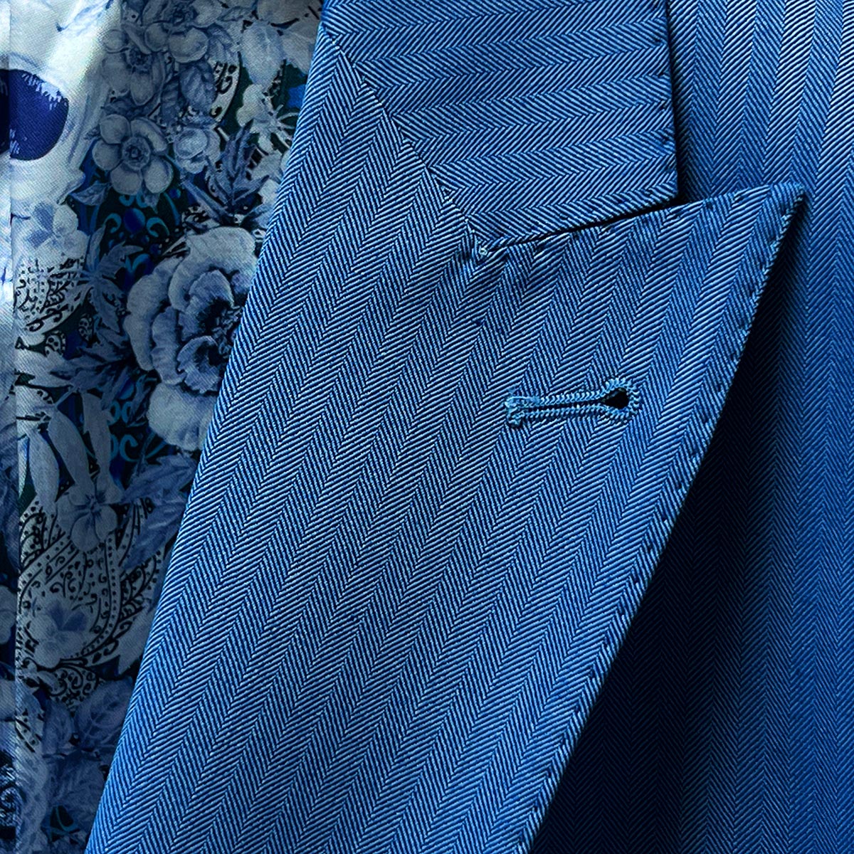 Men's blue herringbone suit in 100% Australian Merino wool, tailored to perfection by our local seamstress.