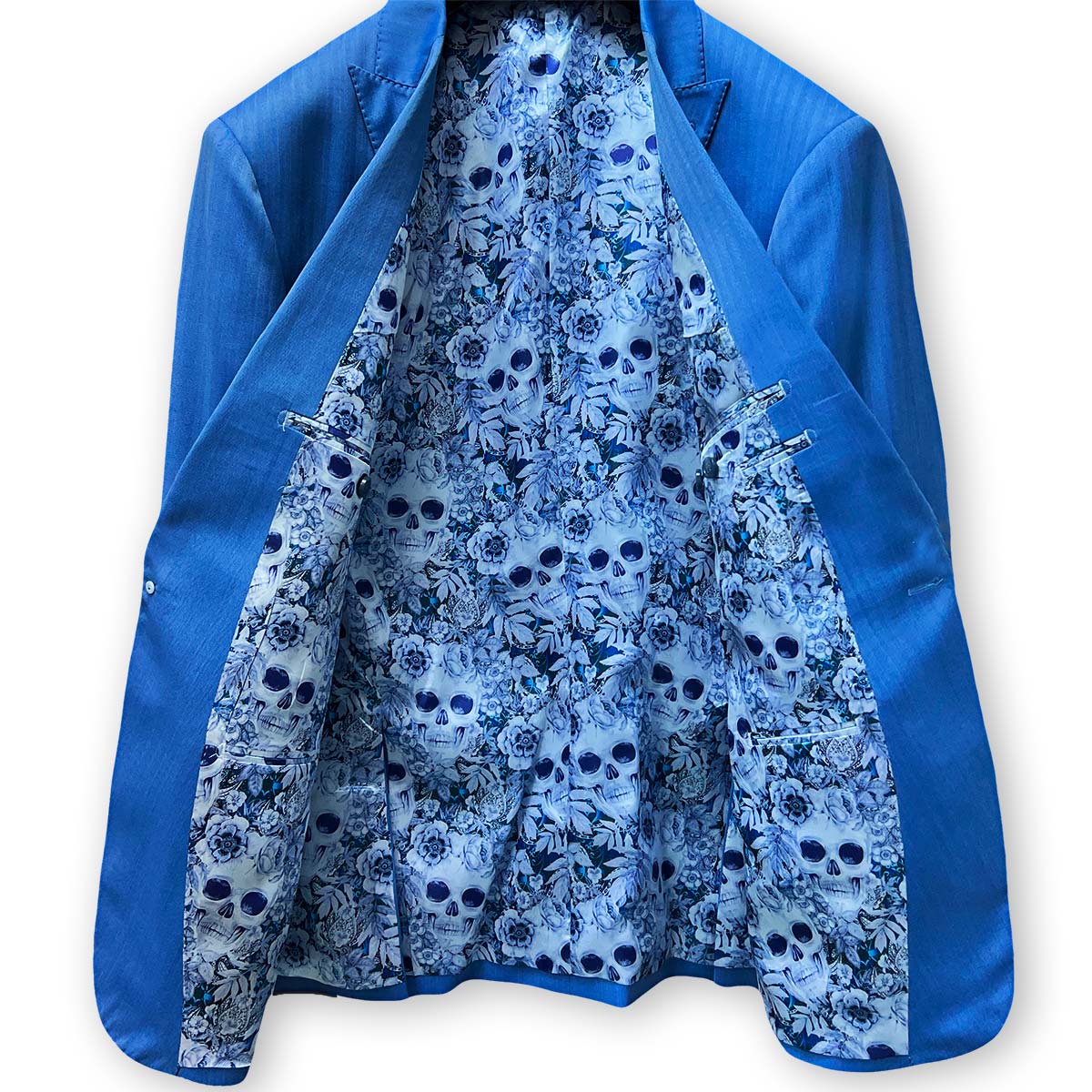 Tailored men's blue herringbone suit, made from 100% Australian Merino wool, available for alterations near you.