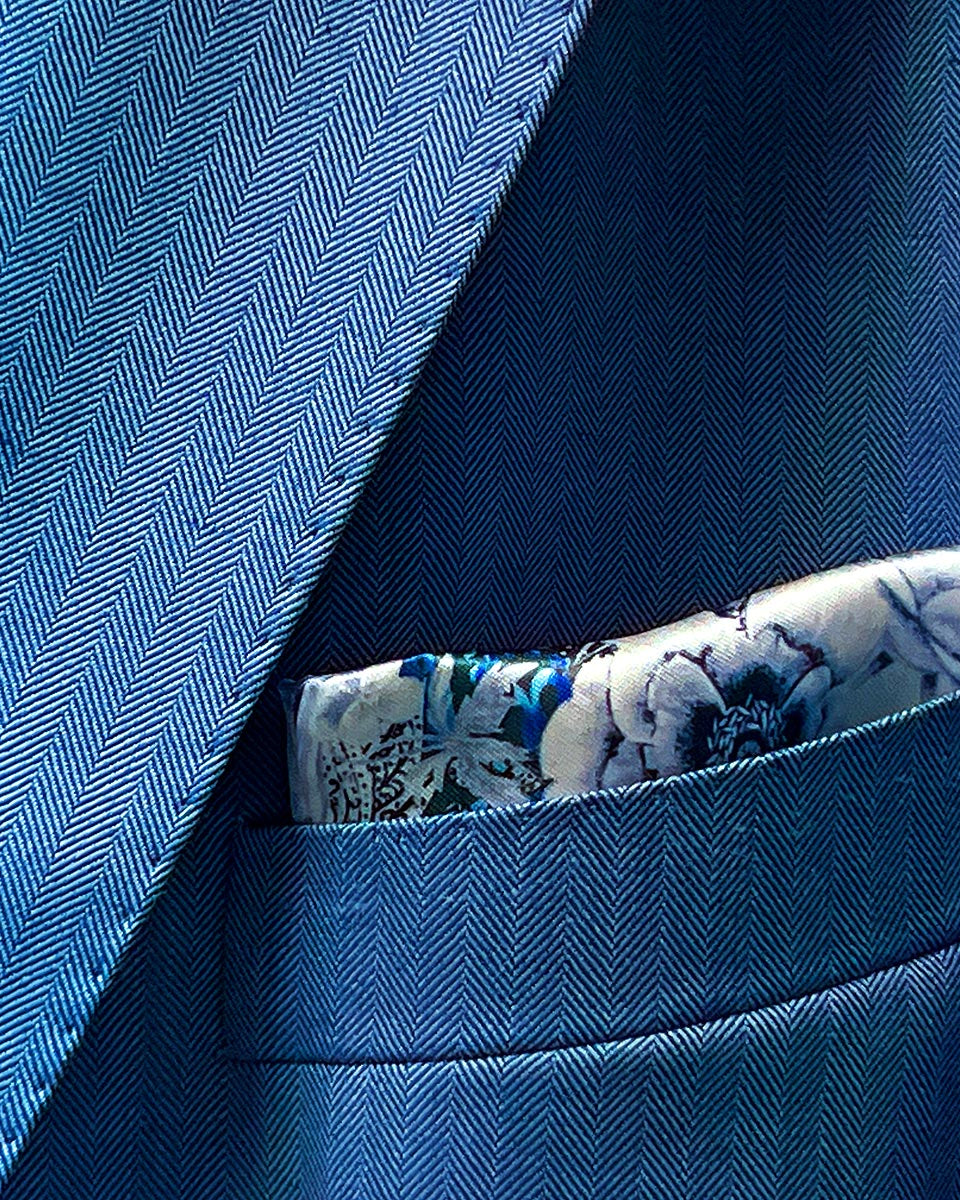 100% Australian Merino wool suit in a blue herringbone pattern, available at Men's Wearhouse.