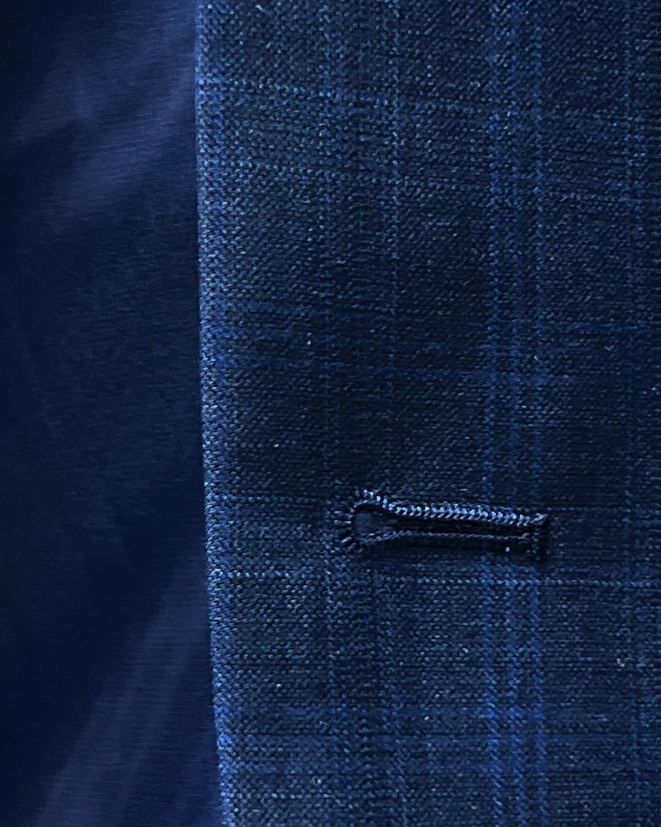 Buttonhole close-up, windowpane.
