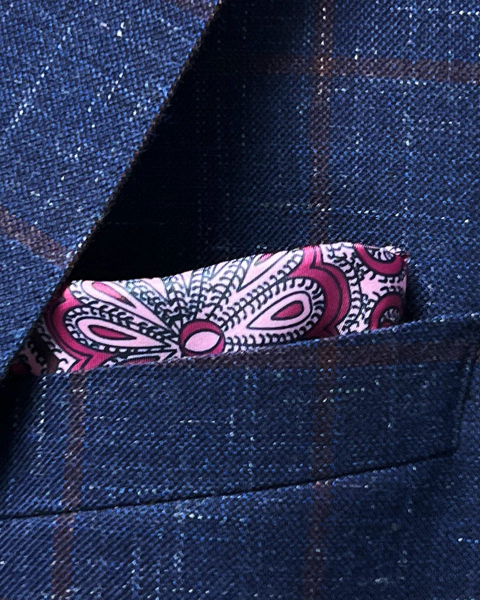 Navy windowpane sport coat chest pocket with coordinating pocket square placement showing styling possibilities and proportion
